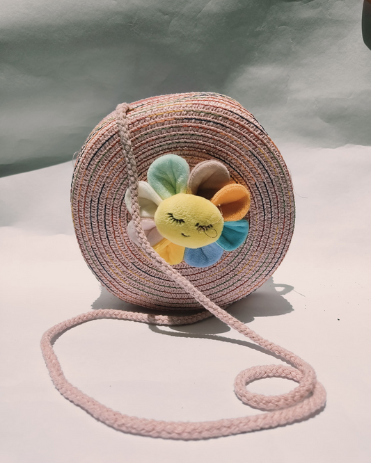 Handwoven Rainbow Sling Bag with Plush Flower – Crafted by Rural Artisans